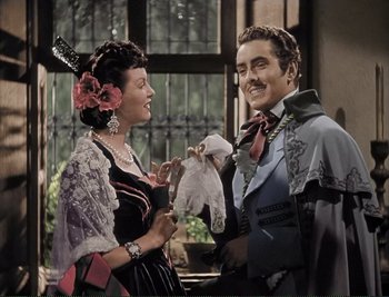 Movie still from “The Mark of Zorro” (1940), directed by Rouben Mamoulian – A man and a woman standing next to each other; Medium shot, High angle
