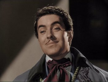 Movie still from “The Mark of Zorro” (1940), directed by Rouben Mamoulian – A person wearing a suit and tie; Close Up shot, Low angle