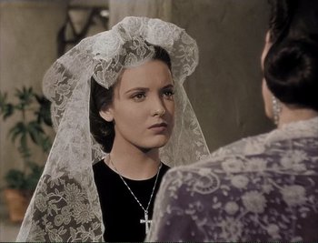 Movie still from “The Mark of Zorro” (1940), directed by Rouben Mamoulian – A woman wearing a veil looking into a mirror; Close Up shot, Over the shoulder angle
