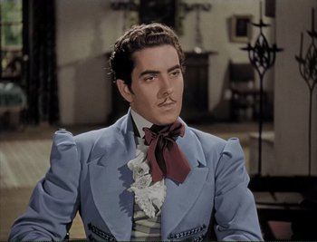 Movie still from “The Mark of Zorro” (1940), directed by Rouben Mamoulian – A person wearing a suit and tie; Close Up shot, Low angle