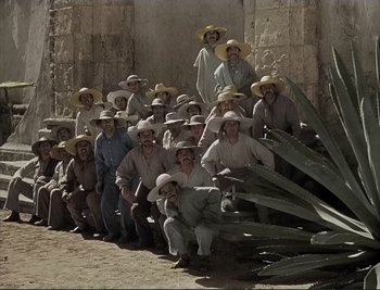 Movie still from “The Mark of Zorro” (1940), directed by Rouben Mamoulian – A group of men wearing hats posing for a picture; Wide shot, High angle
