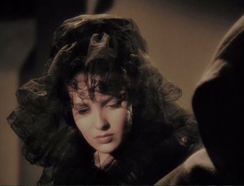 Movie still from “The Mark of Zorro” (1940), directed by Rouben Mamoulian – A person wearing a black dress; Close Up shot, Over the shoulder angle