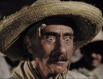 Movie still from “The Mark of Zorro” (1940), directed by Rouben Mamoulian – An old man with a straw hat is looking at the camera; Extreme Close Up shot, High angle