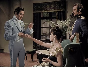 Movie still from “The Mark of Zorro” (1940), directed by Rouben Mamoulian – A group of people standing in a living room; Medium shot, High angle