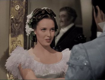 Movie still from “The Mark of Zorro” (1940), directed by Rouben Mamoulian – A painting of a woman in a white dress with flowers in her hair; Close Up shot, Over the shoulder angle