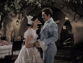 Movie still from “The Mark of Zorro” (1940), directed by Rouben Mamoulian – A man and a woman dressed up as a couple; Medium shot, Low angle