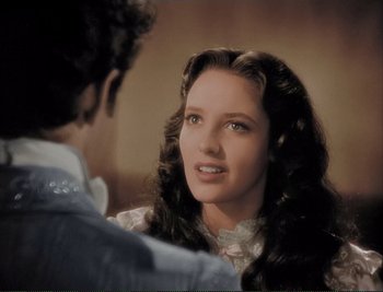 Movie still from “The Mark of Zorro” (1940), directed by Rouben Mamoulian – A woman with long dark hair is looking at a young man; Close Up shot, Over the shoulder angle