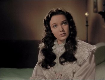 Movie still from “The Mark of Zorro” (1940), directed by Rouben Mamoulian – A woman with long hair wearing a white dress; Close Up shot, High angle