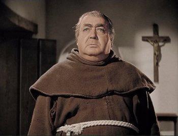Movie still from “The Mark of Zorro” (1940), directed by Rouben Mamoulian – An older man wearing a monk's outfit in a movie scene; Close Up shot, High angle