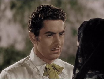 Movie still from “The Mark of Zorro” (1940), directed by Rouben Mamoulian – A person wearing a shirt and a tie; Close Up shot, Over the shoulder angle