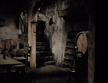 Movie still from “The Mark of Zorro” (1940), directed by Rouben Mamoulian – An empty room with a bunch of wine barrels; Wide shot, High angle