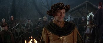 Movie still from “The Masque of the Red Death” (1964), directed by Roger Corman – A person wearing a hat; Medium shot, High angle