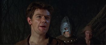 Movie still from “The Masque of the Red Death” (1964), directed by Roger Corman – Two men in medieval garb are standing next to each other; Close Up shot, Over the shoulder angle