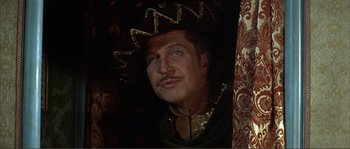 Movie still from “The Masque of the Red Death” (1964), directed by Roger Corman – A person wearing a hat; Close Up shot, High angle