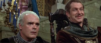 Movie still from “The Masque of the Red Death” (1964), directed by Roger Corman – A man with white hair sitting next to another man with white hair; Close Up shot, Low angle