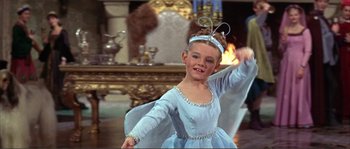 Movie still from “The Masque of the Red Death” (1964), directed by Roger Corman – A little girl dressed as a fairy in a blue dress; Close Up shot, High angle