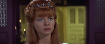 Movie still from “The Masque of the Red Death” (1964), directed by Roger Corman – A person wearing a tiara; Close Up shot, Over the shoulder angle