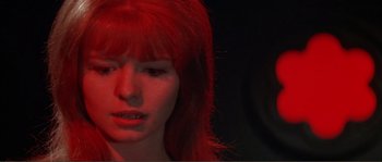 Movie still from “The Masque of the Red Death” (1964), directed by Roger Corman – A person with red hair; Close Up shot, Low angle