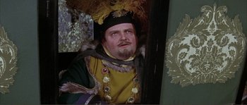 Movie still from “The Masque of the Red Death” (1964), directed by Roger Corman – A person wearing a costume; Close Up shot, High angle