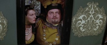 Movie still from “The Masque of the Red Death” (1964), directed by Roger Corman – A man and a woman dressed in medieval garb; Medium shot, Over the shoulder angle