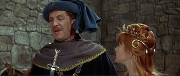 Movie still from “The Masque of the Red Death” (1964), directed by Roger Corman – A man and a woman dressed in medieval garb; Close Up shot, Over the shoulder angle
