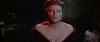 Movie still from “The Masque of the Red Death” (1964), directed by Roger Corman – A person wearing a necklace; Close Up shot, Overhead angle