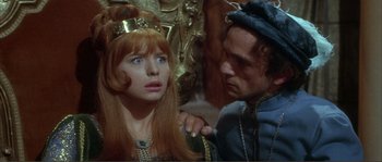 Movie still from “The Masque of the Red Death” (1964), directed by Roger Corman – A man and a woman are looking at each other; Close Up shot, Over the shoulder angle