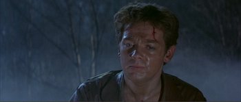 Movie still from “The Masque of the Red Death” (1964), directed by Roger Corman – A person with blood on his face; Close Up shot, High angle