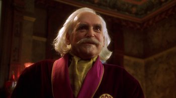 Movie still from “The Master of Disguise” (2002), directed by Perry Andelin Blake – An older man with long white hair and a beard; Close Up shot, Low angle