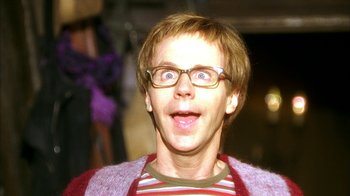 Movie still from “The Master of Disguise” (2002), directed by Perry Andelin Blake – A young man with glasses is making a funny face; Close Up shot, Low angle