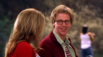 Movie still from “The Master of Disguise” (2002), directed by Perry Andelin Blake – A man and a woman are talking to each other; Close Up shot, Over the shoulder angle