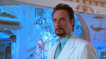 Movie still from “The Master of Disguise” (2002), directed by Perry Andelin Blake – A person wearing a suit and tie; Close Up shot, Low angle