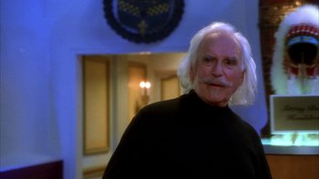 Movie still from “The Master of Disguise” (2002), directed by Perry Andelin Blake – An older man with white hair is smiling; Close Up shot, Low angle