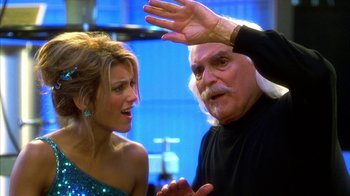 Movie still from “The Master of Disguise” (2002), directed by Perry Andelin Blake – An older man and a young woman looking at each other; Close Up shot, Over the shoulder angle