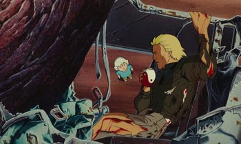 Movie still from “The Masters of Time” (1982), directed by René Laloux – An animated scene of a man sitting in a chair with a cup of coffee; Wide shot, High angle