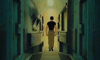 Movie still from “The Masters of Time” (1982), directed by René Laloux – A man walking down the hallway of a prison cell; Wide shot, Low angle
