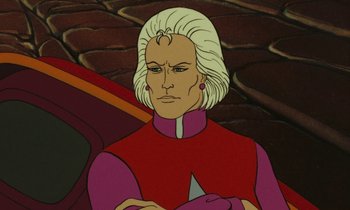 Movie still from “The Masters of Time” (1982), directed by René Laloux – A man in a red and white shirt is looking at the camera; Close Up shot, Low angle