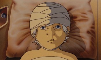 Movie still from “The Masters of Time” (1982), directed by René Laloux – A child with a bandage on his head; Close Up shot, Overhead angle
