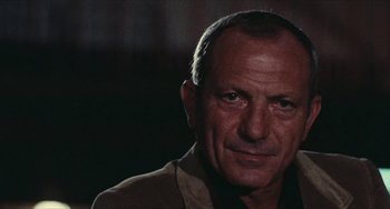 Movie still from “The Mattei Affair” (1972), directed by Francesco Rosi – A person wearing a jacket; Close Up shot, Low angle