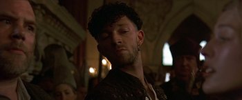 Movie still from “The Messenger: The Story of Joan of Arc” (1999), directed by Luc Besson – A person with his eyes closed; Close Up shot, Low angle