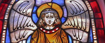 Movie still from “The Messenger: The Story of Joan of Arc” (1999), directed by Luc Besson – A stained - glass window of an archangel with wings; Extreme Close Up shot, Low angle