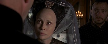 Movie still from “The Messenger: The Story of Joan of Arc” (1999), directed by Luc Besson – A person wearing a veil; Close Up shot, Over the shoulder angle