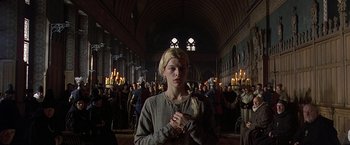 Movie still from “The Messenger: The Story of Joan of Arc” (1999), directed by Luc Besson – A woman standing in front of a group of people; Medium shot, Low angle