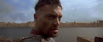 Movie still from “The Messenger: The Story of Joan of Arc” (1999), directed by Luc Besson – A person wearing armor; Close Up shot, Low angle