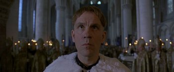 Movie still from “The Messenger: The Story of Joan of Arc” (1999), directed by Luc Besson – A person wearing a white cape; Close Up shot, Low angle