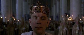 Movie still from “The Messenger: The Story of Joan of Arc” (1999), directed by Luc Besson – A person wearing a crown; Close Up shot, High angle