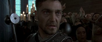 Movie still from “The Messenger: The Story of Joan of Arc” (1999), directed by Luc Besson – A person wearing armor; Close Up shot, Low angle