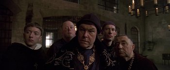 Movie still from “The Messenger: The Story of Joan of Arc” (1999), directed by Luc Besson – A group of men standing next to each other; Close Up shot, Low angle