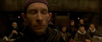 Movie still from “The Messenger: The Story of Joan of Arc” (1999), directed by Luc Besson – A person with his eyes closed; Close Up shot, High angle