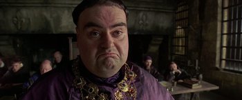 Movie still from “The Messenger: The Story of Joan of Arc” (1999), directed by Luc Besson – A person wearing a purple shirt; Close Up shot, Low angle